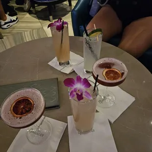 Drinks (finishing school is the one garnished with the orchid flower)