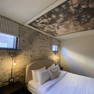 Bedroom area with ceiling tapestry