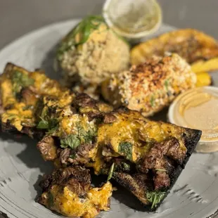 a plate of grilled meat and vegetables