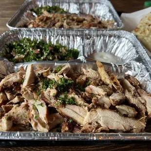 Chicken Shawarma plate with tabbouleh and charcoal sauce. Tandoori bread side