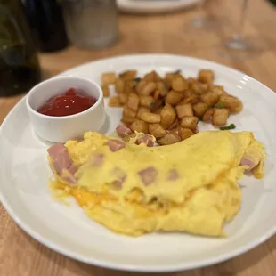 Ham and cheese omelette with seasoned potatoes