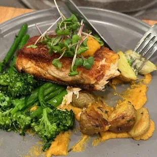 Winter spiced salmon with baby potatoes and broccolini