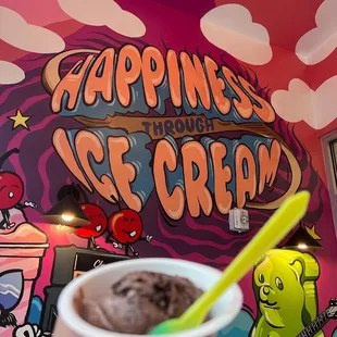 a person holding a cup of ice cream