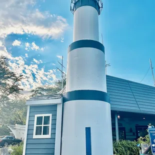 a white and blue lighthouse