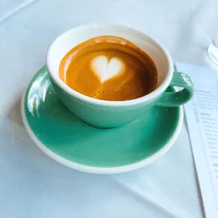 Fresh brewed cappuccino served at brunch with a gorgeous heart