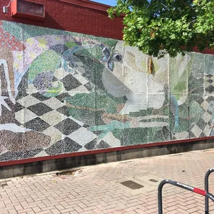 a mosaic on the side of a building