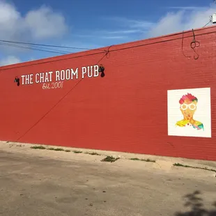 a red brick building with a sign on it