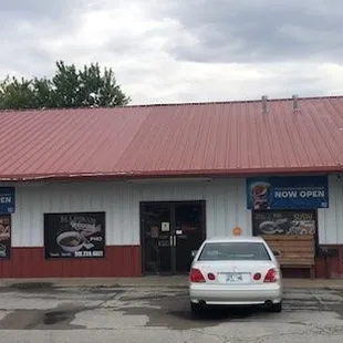 a car parked in front of the restaurant