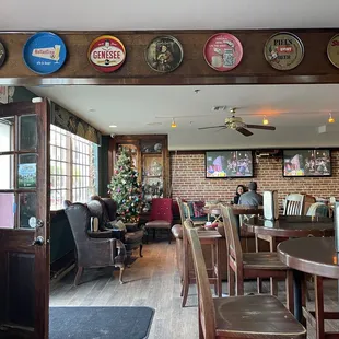 A warm and inviting space with lots of wood, leather and brick.