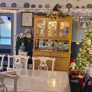 a dining room decorated for christmas