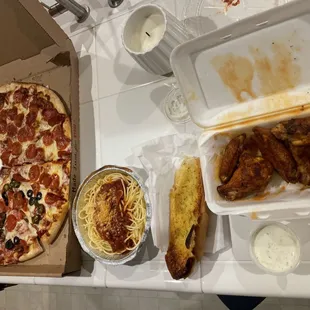 Large pepperoni with half block olives and jalapeños. Wings and spaghetti with meat sauce