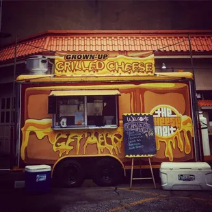 a food truck with graffiti on it