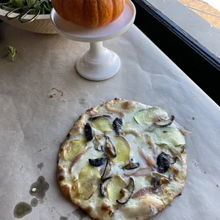 Handmade pizza 1 from our pizza making class. Lots of cheeses and different ingredients on different parts of the pizza