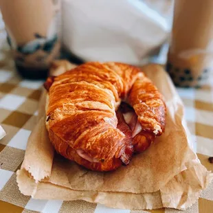 Ham &amp; cheese croissant / $7.95, w/ bacon / $2.95