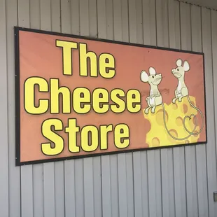 a sign for the cheese store