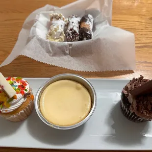 Cannolis, Cheesecake, Vanilla and Chocolate Cupcakes.