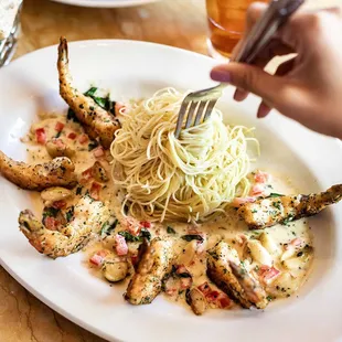 a plate of pasta and shrimp