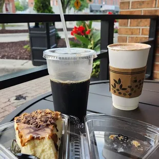 Slice of cheesecake, hot chocolate, and cold brew on a morning mini date