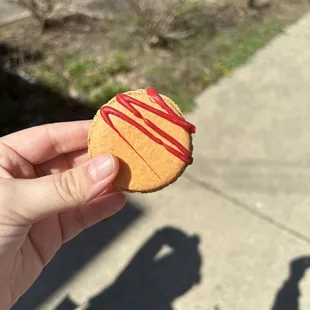 a person holding a cookie