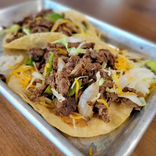 two tacos on a tray