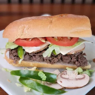 a sandwich with meat and vegetables