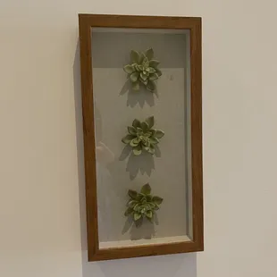 Artwork near bathroom hall