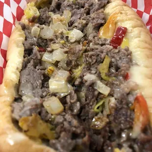 Get a philly with your choice of ribeye steak or chicken served on an amoroso roll with white American cheese or cheez whiz!
