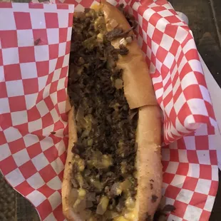 Cheesesteak with grilled onions and cheese wiz.