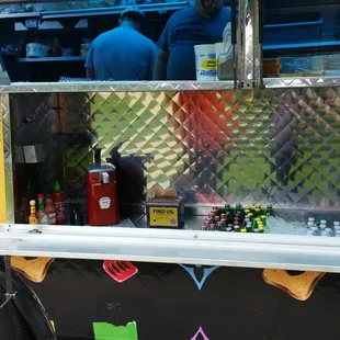 a man standing in front of a food truck