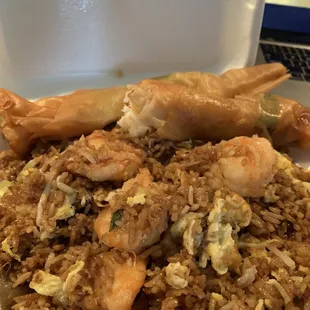 a plate of fried rice and shrimp