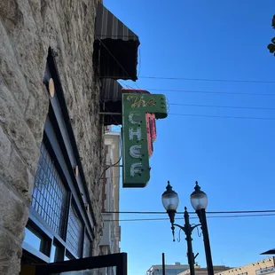 a restaurant sign on the side of a building