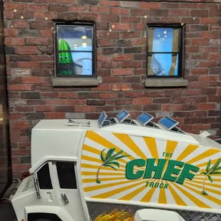 Miniature truck on display, it's an animated display. Adorable.