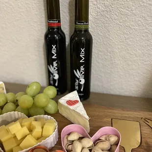 lives, cheese, nuts, grapes, and cheese