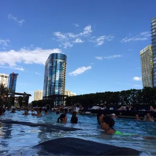 Beautiful day with blue skies in the background. Lounge chairs inside pool.  Awesome!