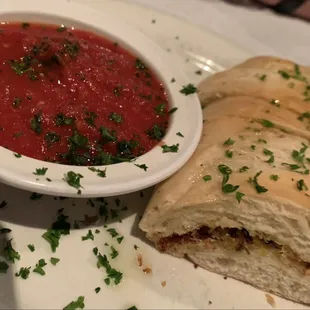 a bowl of soup and a sandwich