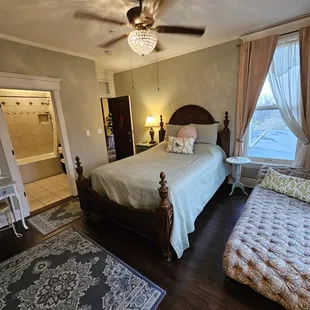 The Cherry Blossom looks over the gazebo &amp; rose garden spaces. Features a jetted tub. Lounge can be made into small kid bed.