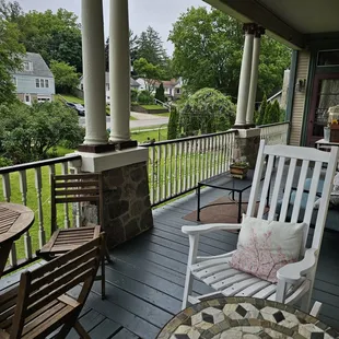 Relax in our many seating areas on the wraparound porch