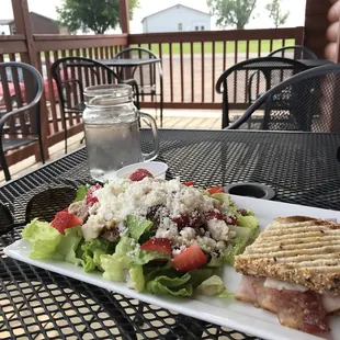 The half strawberry feta chicken salad and half turkey bacon cranberry panini.
