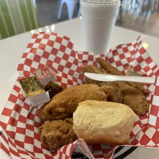 Two piece dark meat meal with biscuit.