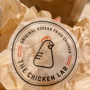 a paper bag with a chicken on it