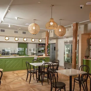 a dining area with tables and chairs