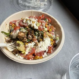 a person taking a picture of a plate of food