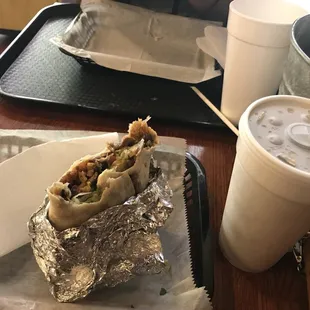 Veggie burrito and a cherry Coke