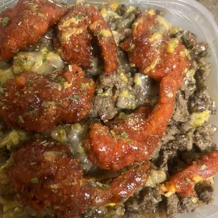 Cheesesteak with buffalo prawns over fried rice