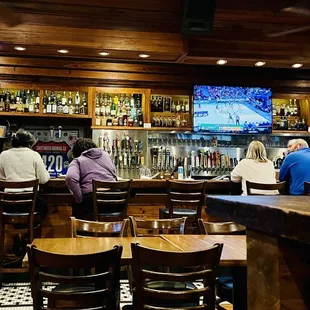 Bar area with dozen of beers on tap.