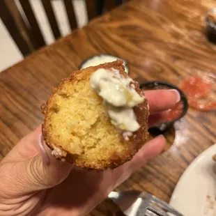 a person holding a piece of cake