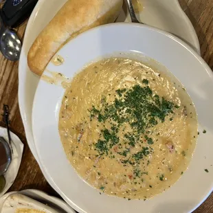 a bowl of soup and bread