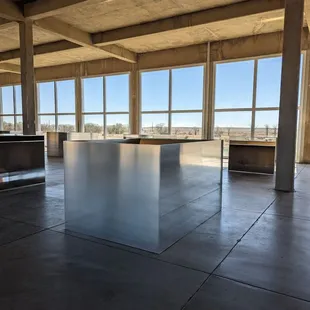 Inside. 50 individual and uniquely milled aluminum cube,spaced and displayed perfectly regarding inside,light and outside view