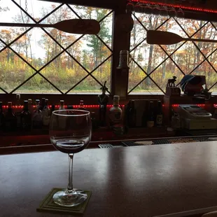 a glass of wine on the bar