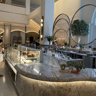 a woman standing in front of the counter